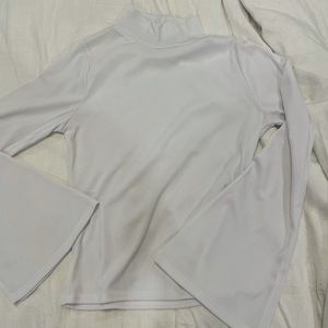 White mock neck crop top with bell sleeves